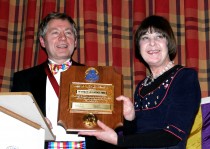 Bev receives award from Lion Vice President Tom