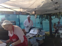 Helper Maureen Coney with Lion Richard Collins feeding the drinkers