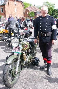 Motorcycle and owner in uniform